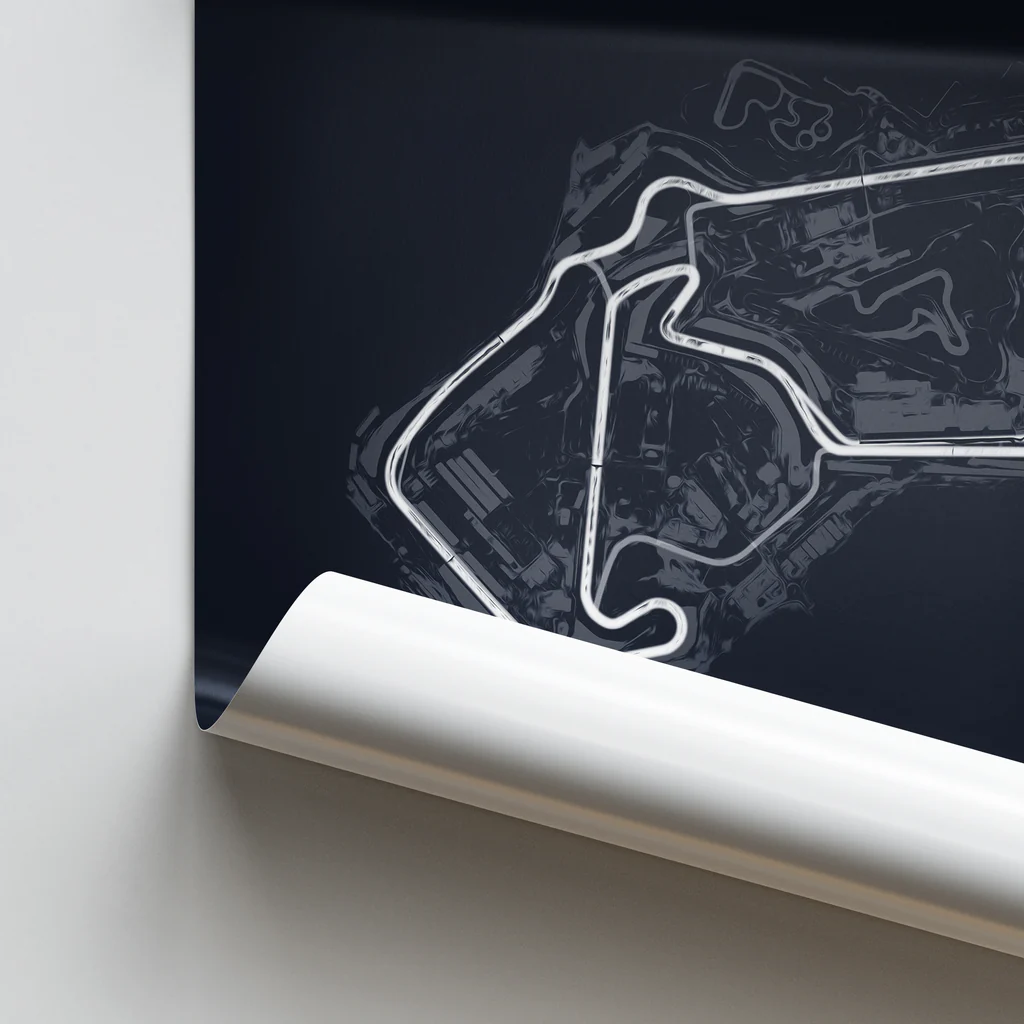 Roll of paper with a white outline of a race track design on a dark background