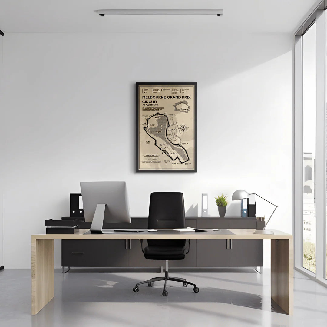 Modern office setup with a desk, chair, and framed map on the wall.