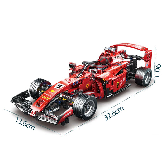 Red Formula 1 car model with dimensions on a white background