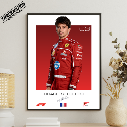 Framed poster of Charles Leclerc in a red racing suit with sponsor logos, displayed on a wall.